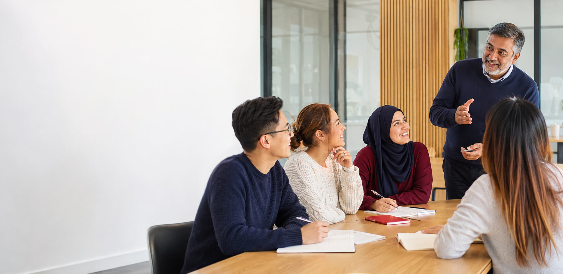 Adults developing practical English communication skills with Zia's Language Centre in Edmonton